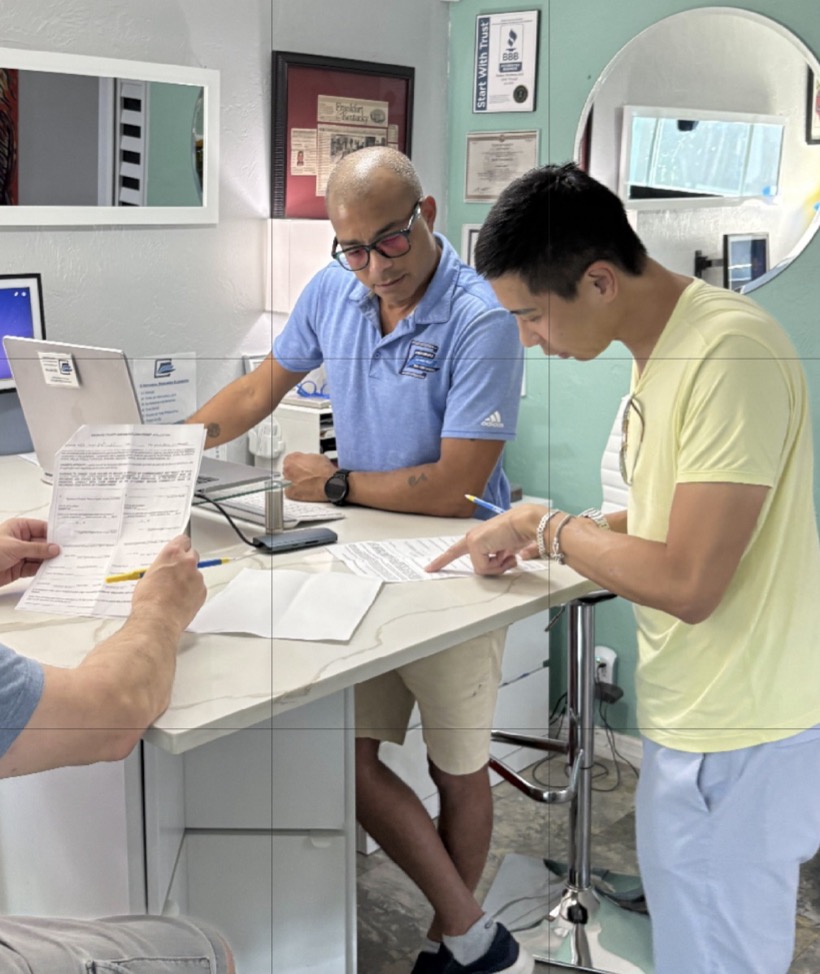 Carlton of Notary Etcetera reviewing documents with clients